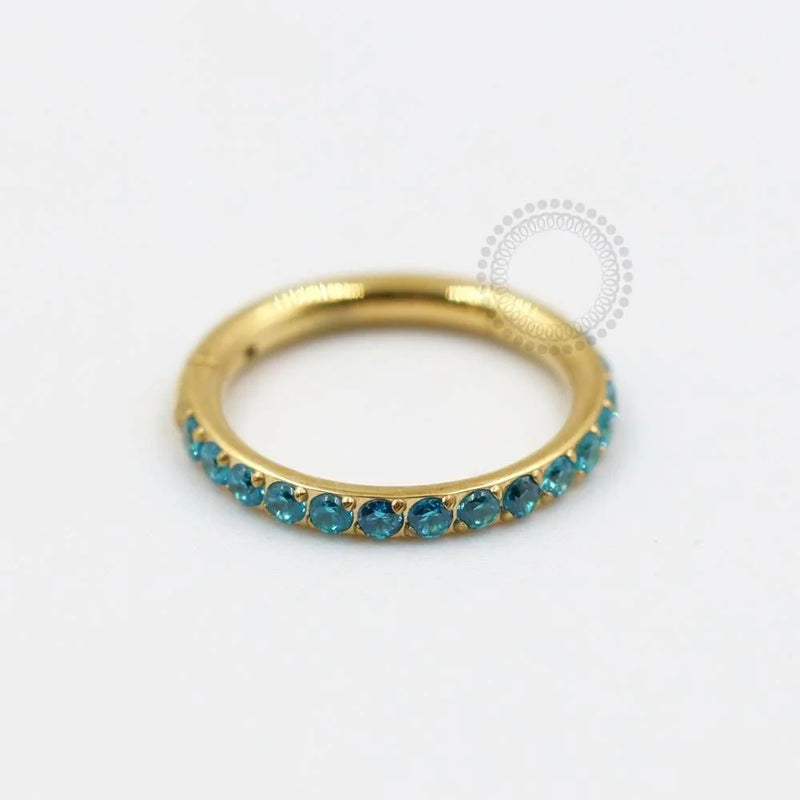 TN310 Segmento Cravejado Aqua Blue Titânio PVD Gold