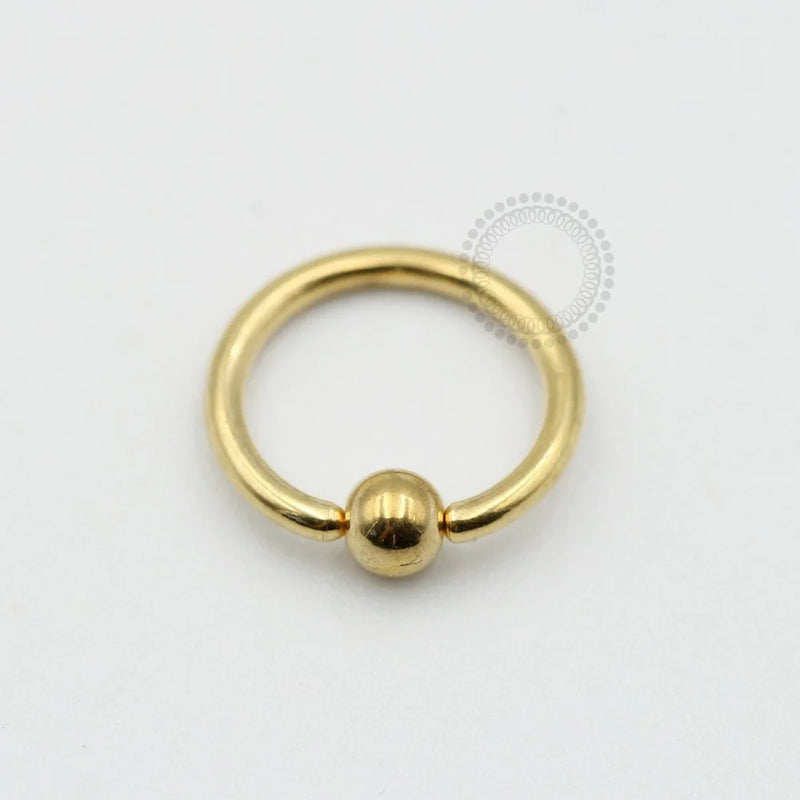 TN562 Captive Titãnio PVD Gold